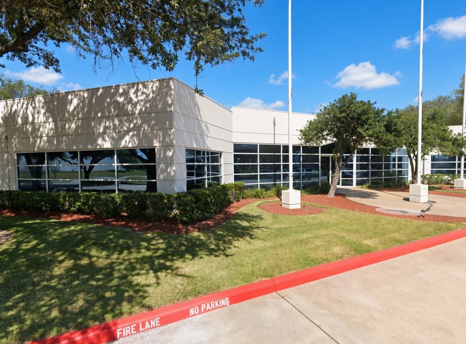 Single-story Sugar Land office building in a landscaped campus setting